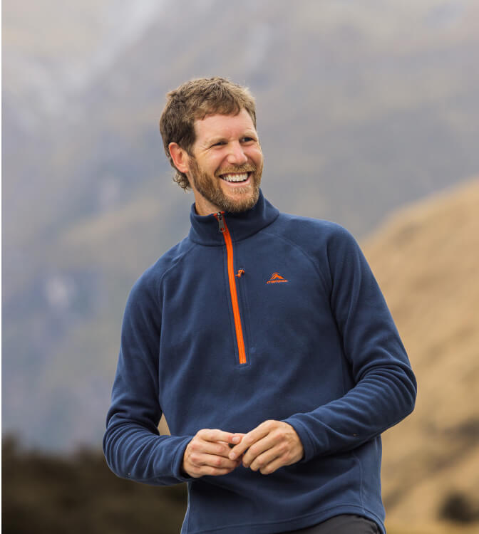 Man wearing macpac fleece in rugged country