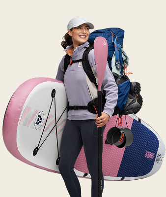 WOMAN WITH SURFBOARD AND BACKPACK